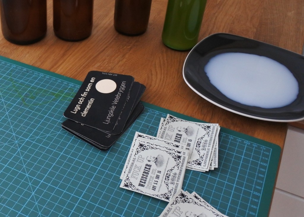 Gluing beer labels with milk.